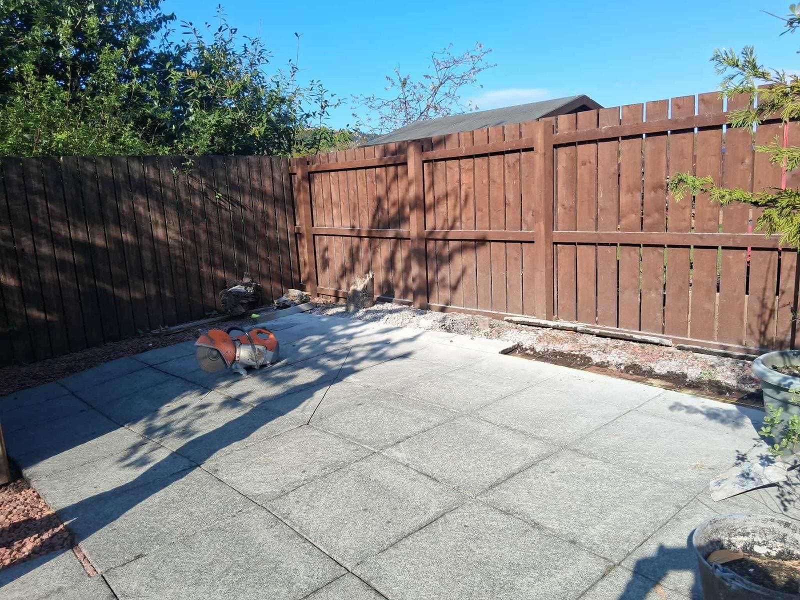 Close-board fencing with concrete posts and gravel boards