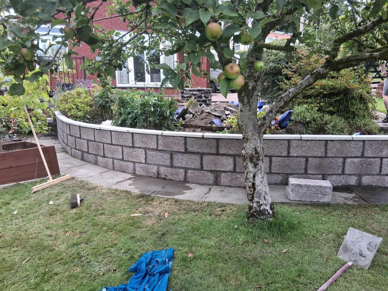 Block retaining wall in sloped garden