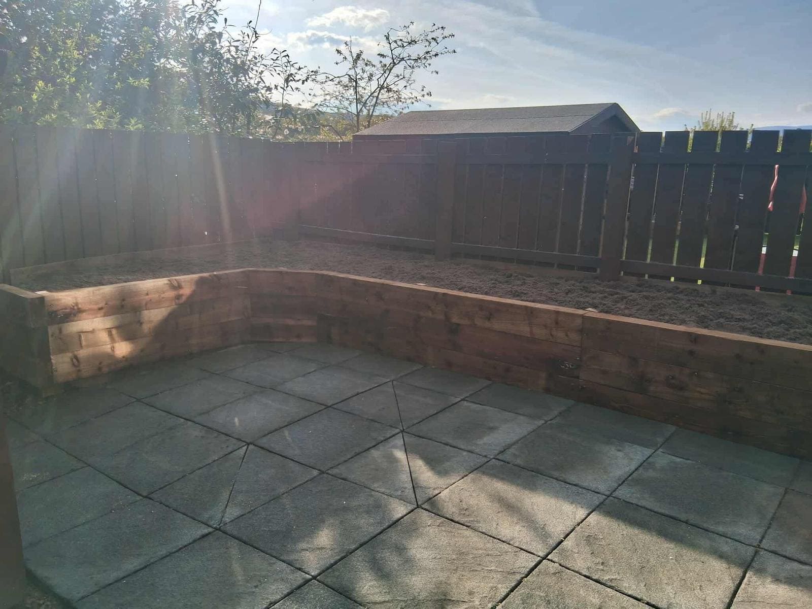 Retaining wall with patio area below